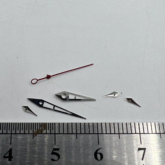 Green luminous watch hands with silver trim for ISA 9238 quartz movement, precise and durable.