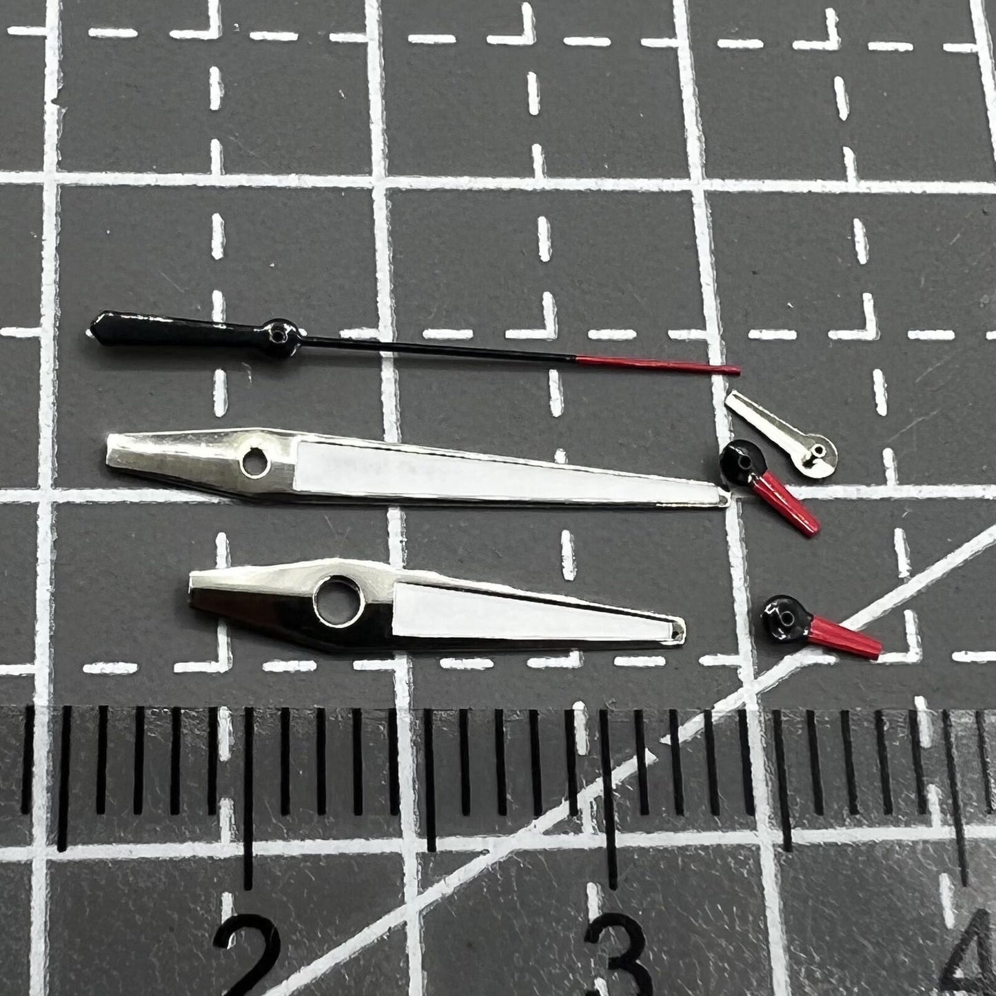 Red and white small second watch hands with silver trim for Miyota OS series, precision accessory.