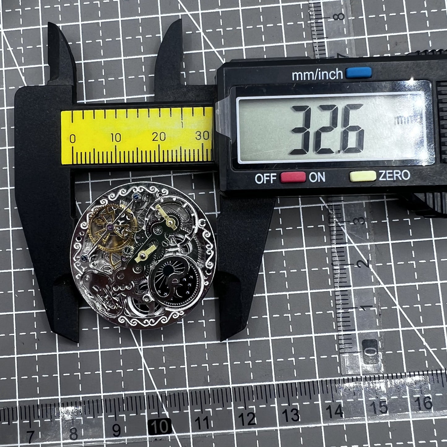 Small silver hollow watch movement with double mainspring and balance wheel at 6 o?clock by Kleines brand.