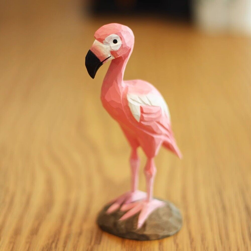 Handmade pink flamingo wooden figurine, charming decor for watch accessory display.
