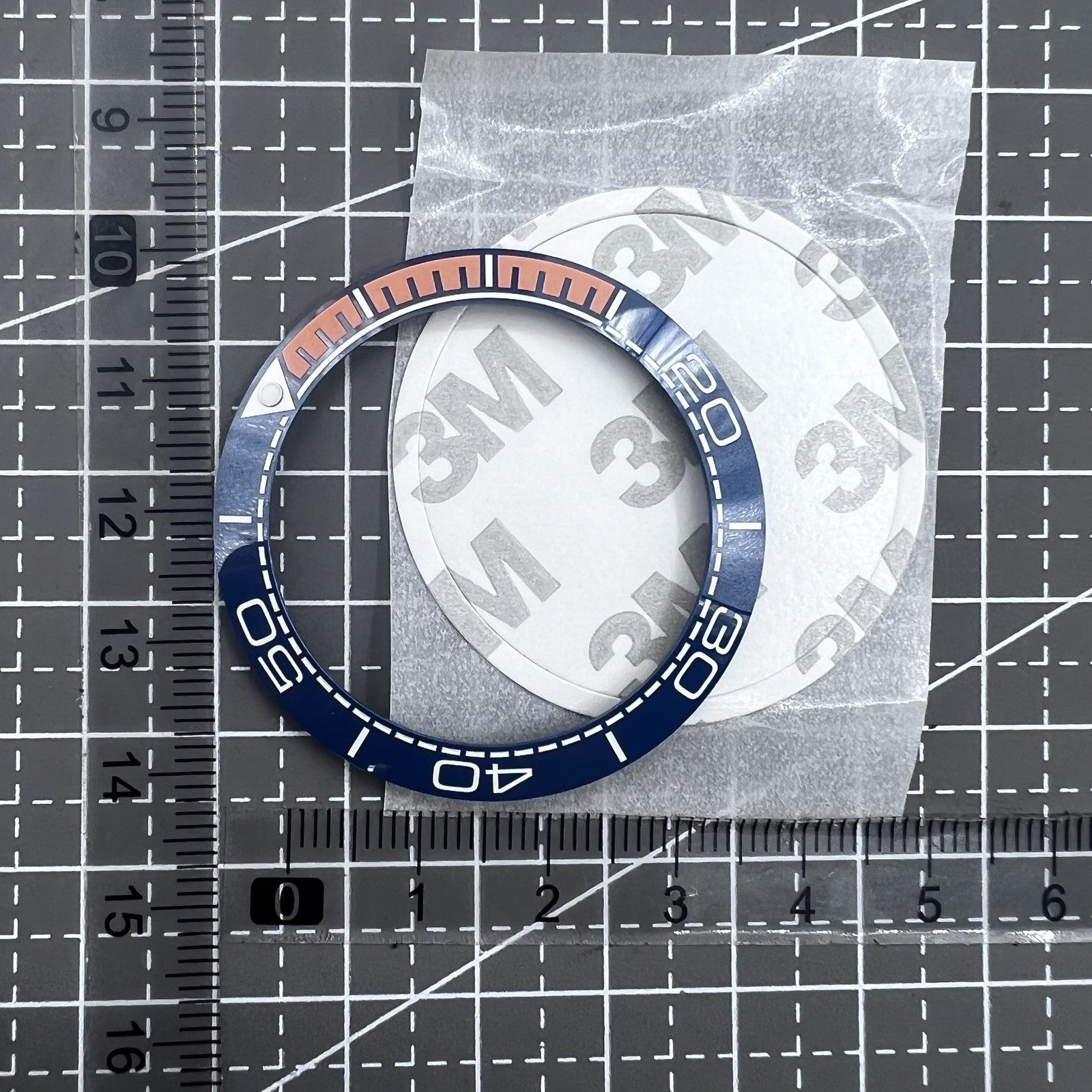 Keramik L�netteneinlage Dunkelblau 41,5mm x 32,5mm mit oranger Schrift f�r Uhrteile