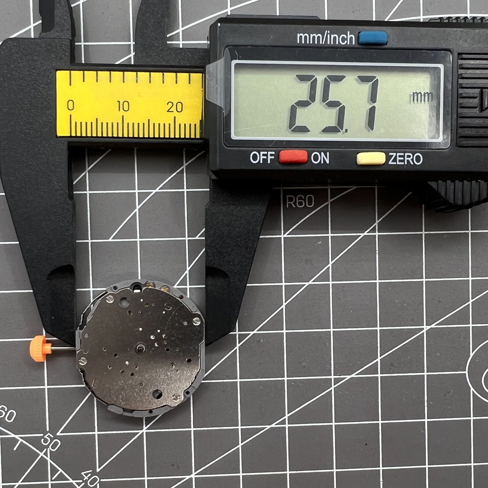 Japan Miyota JS10 quartz watch movement showing small second hand at 6 o?clock for precision timing.