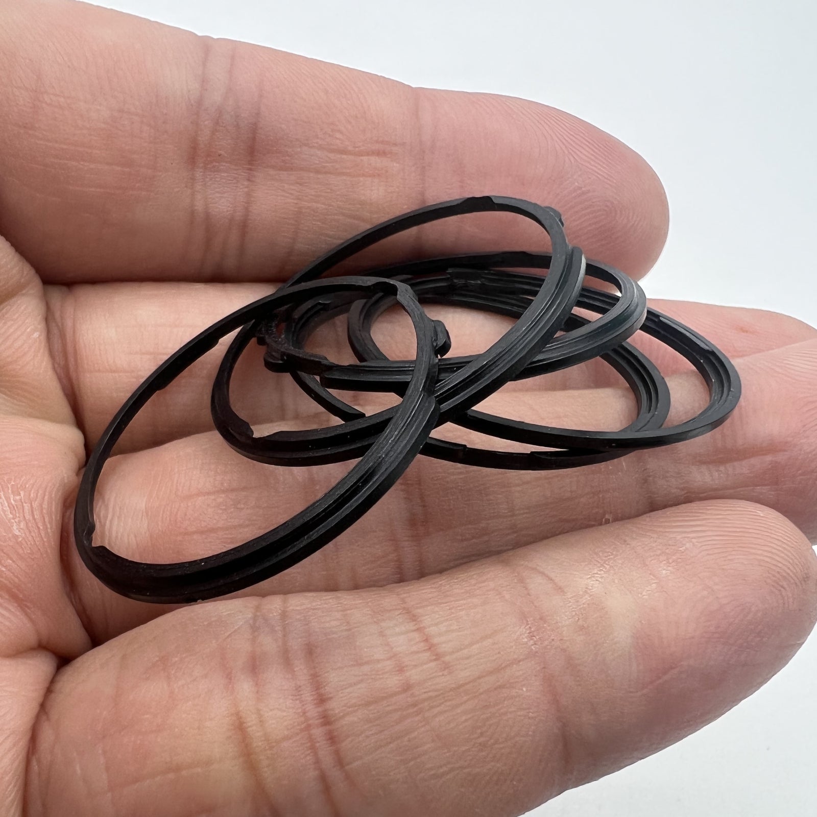 Black cushion mount spacer ring for Orient 46941 watch movement, enhancing dial stability and fit.