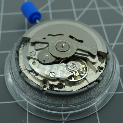 NH35A automatic watch movement by Seiko with black spade hands and SKX007 style crown at 3 o'clock.