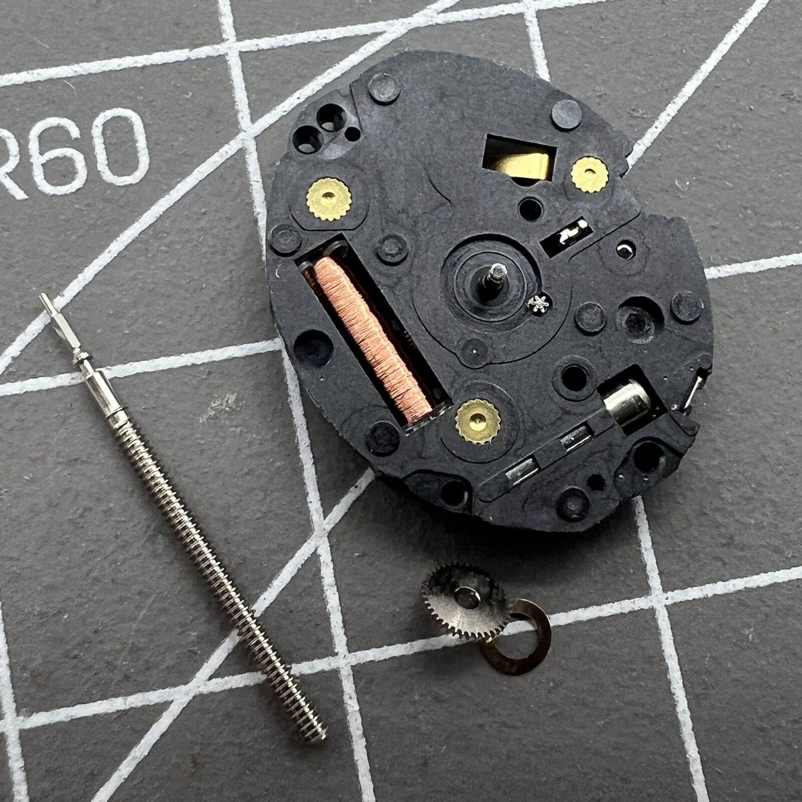 Epson TMI VX10A quartz watch movement with 2 hands, precise timekeeping for watch repair.