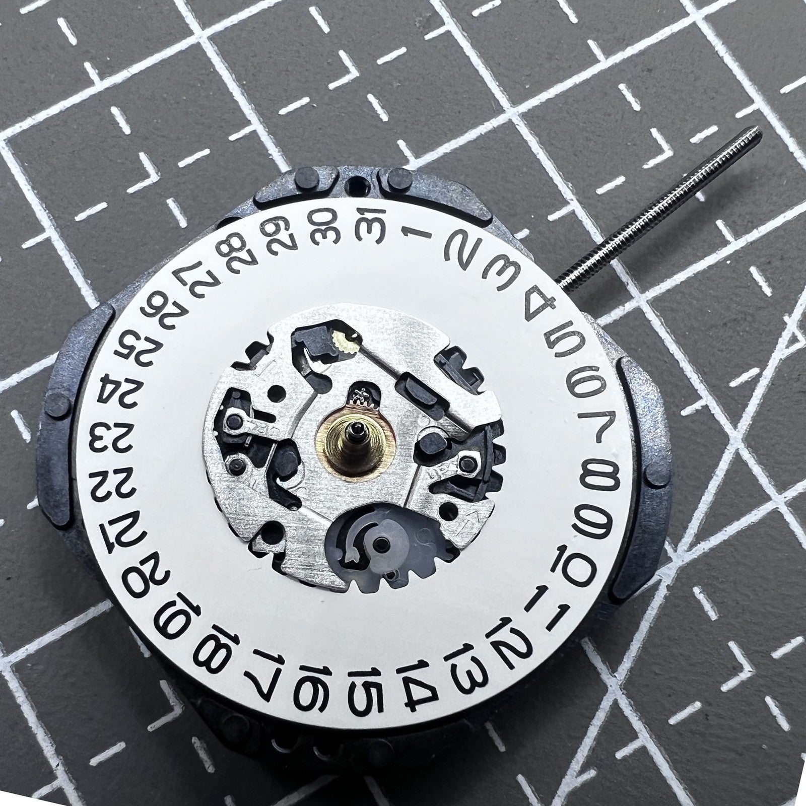 Seiko 7N32C Quartz watch movement showing three hands and single date at 3 o'clock for watch accessories.
