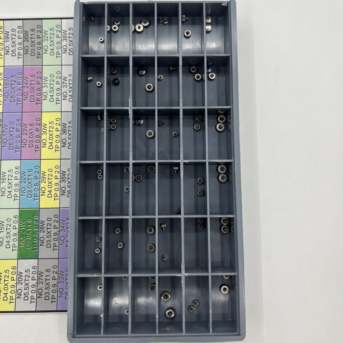 Stainless steel watch crown set, 72 pieces in 36 sizes for precise watch repair tasks.