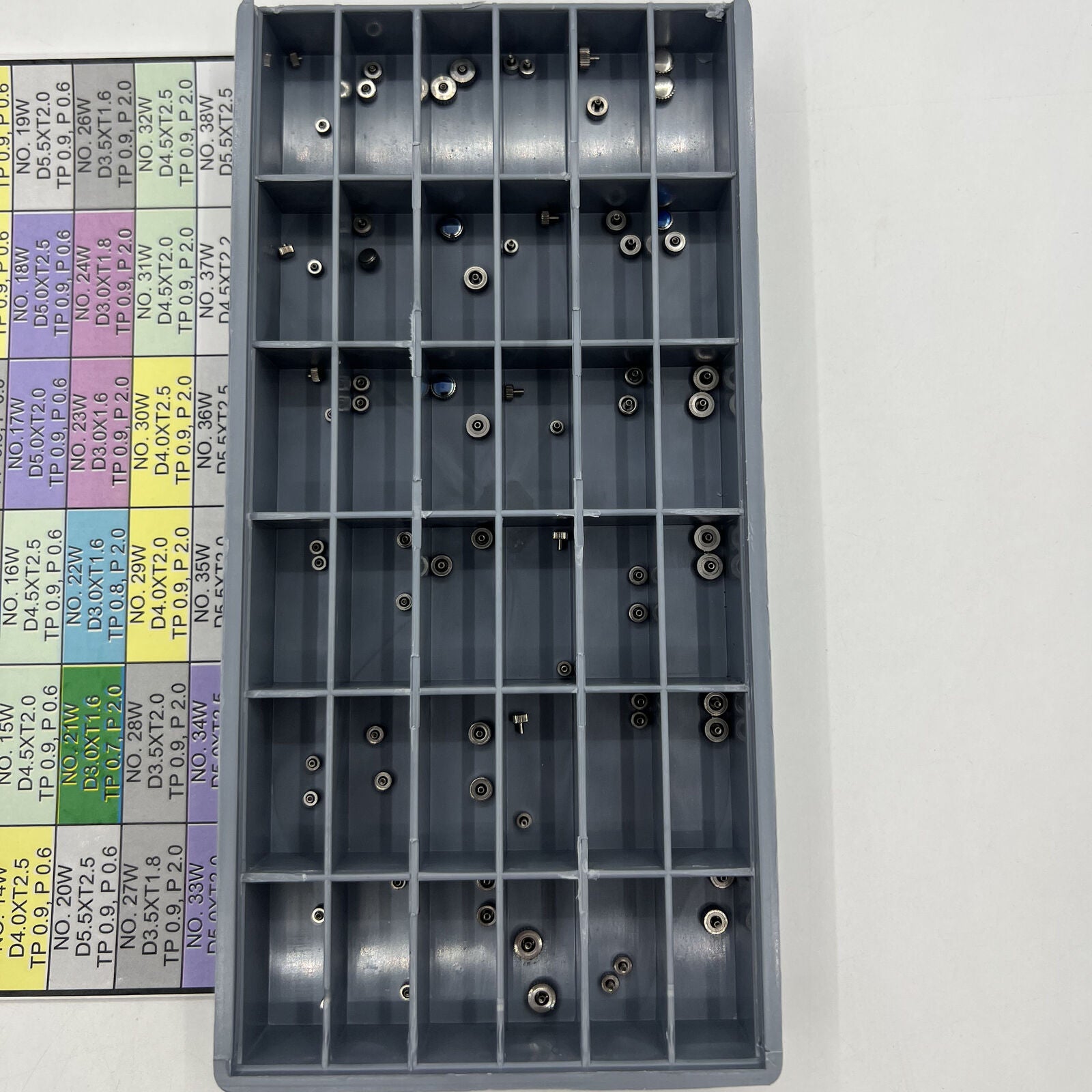 Stainless steel watch crown set, 72 pieces in 36 sizes for precise watch repair tasks.