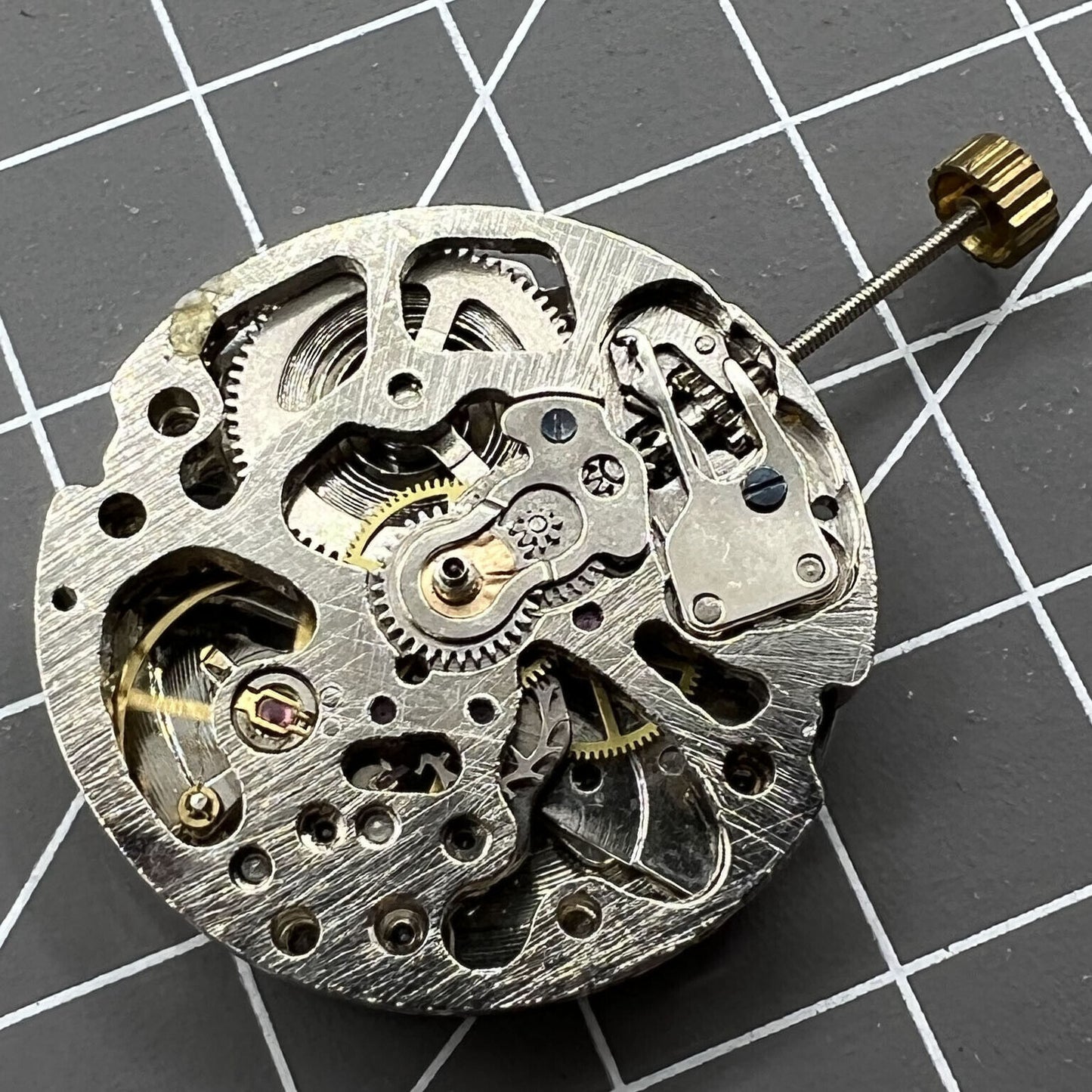 DANDONG 26.5mm hollow silver automatic mechanical watch movement showcasing intricate gears and precision engineering.