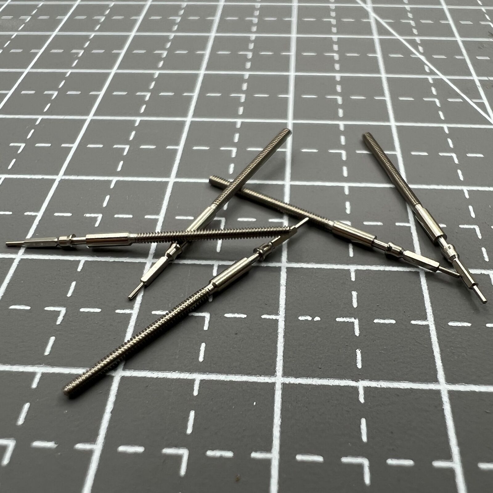 1. Five-pack generic watch winding stems for Miyota 9015 movement, compatible with various watch models.  