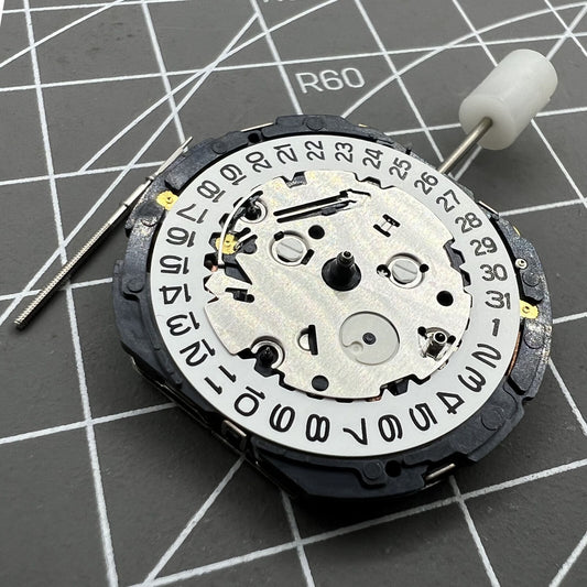 Orient KFB00 Japan quartz watch movement with date display at 3 o'clock on white disk replacement part