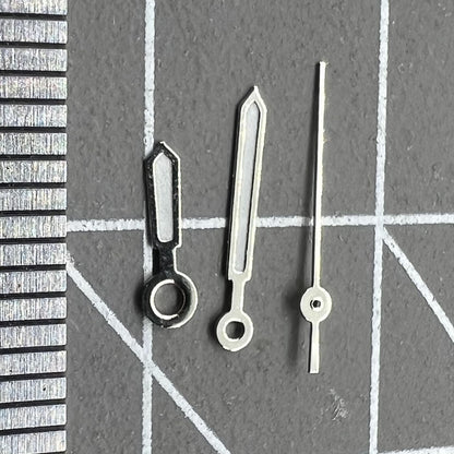 9.5mm white-trimmed green lume watch hands by Miyota for 1L12 Japan quartz movement precision.