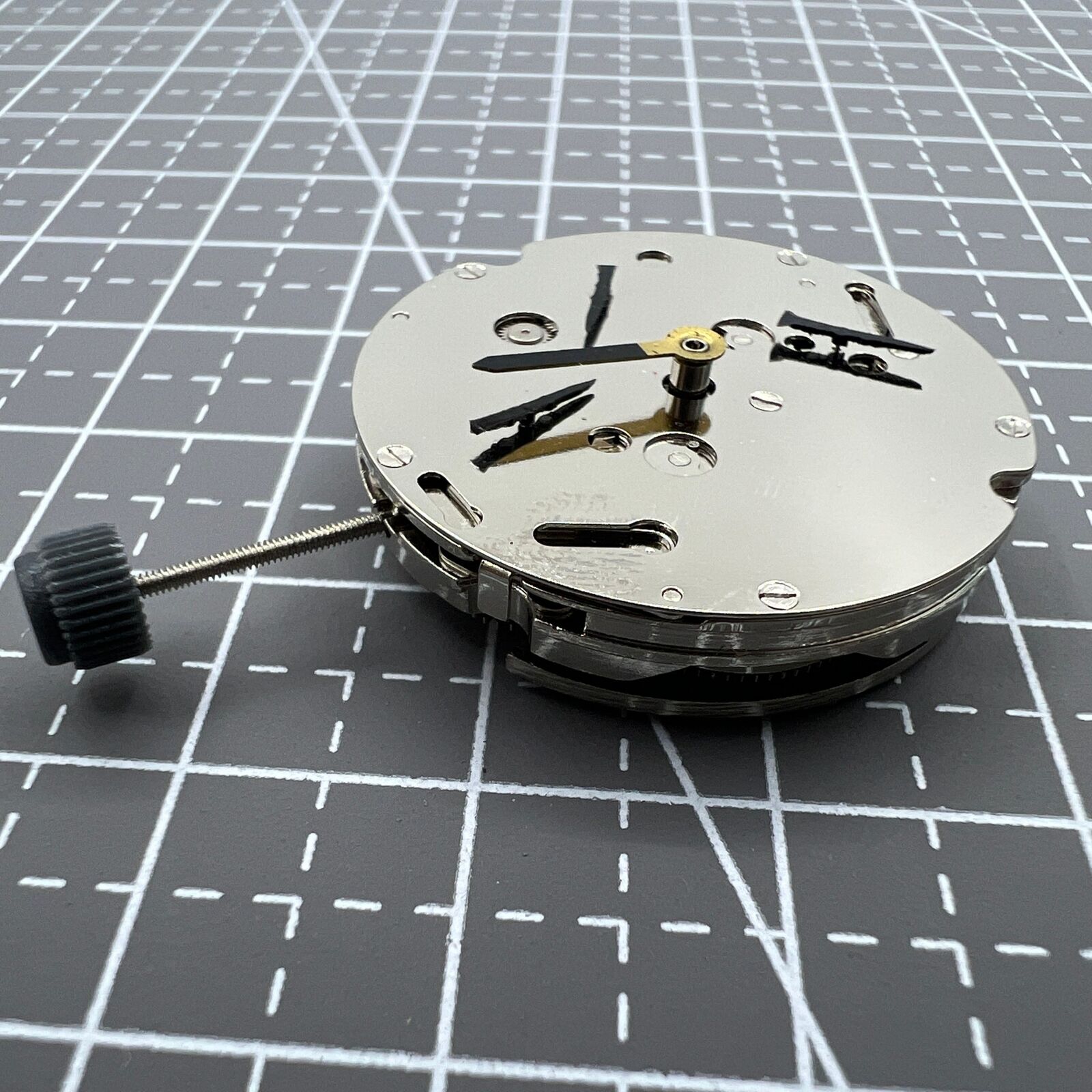 DG2813 automatic watch movement showing three large hands and small seconds subdial at 6 o'clock without calendar.