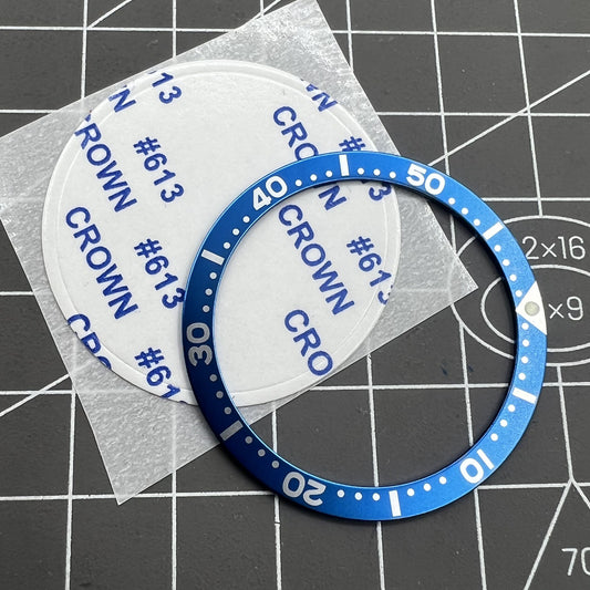 38 mm/31,5 mm blaue Ziffern-Uhrenlünetteneinlage aus Aluminium