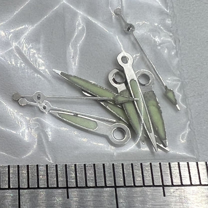 Luminous white-trimmed watch hands for Miyota 2035 quartz movement by P1-H4-C101, perfect for precise watch repairs.