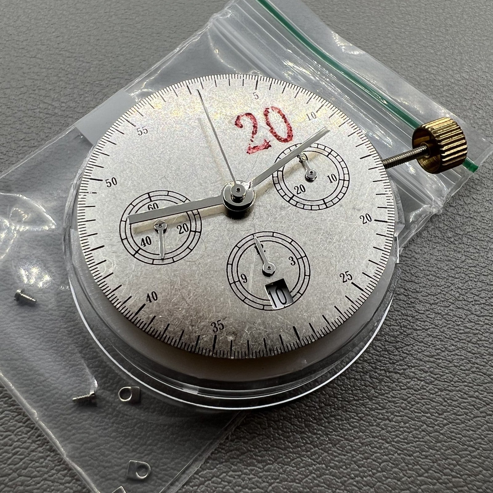 Chronograph watch accessory with ETA 7750, white dial, calendar at 6, second hand at 9 for precise timekeeping.