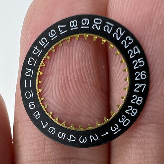 Black date disk wheel showing date at 3 o'clock for Ronda 785 quartz watch movement.