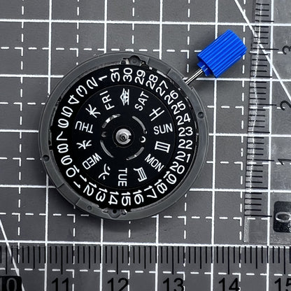 Seiko NH36A automatic watch movement with black finish and green luminescent markers, crown at 3:80 position.