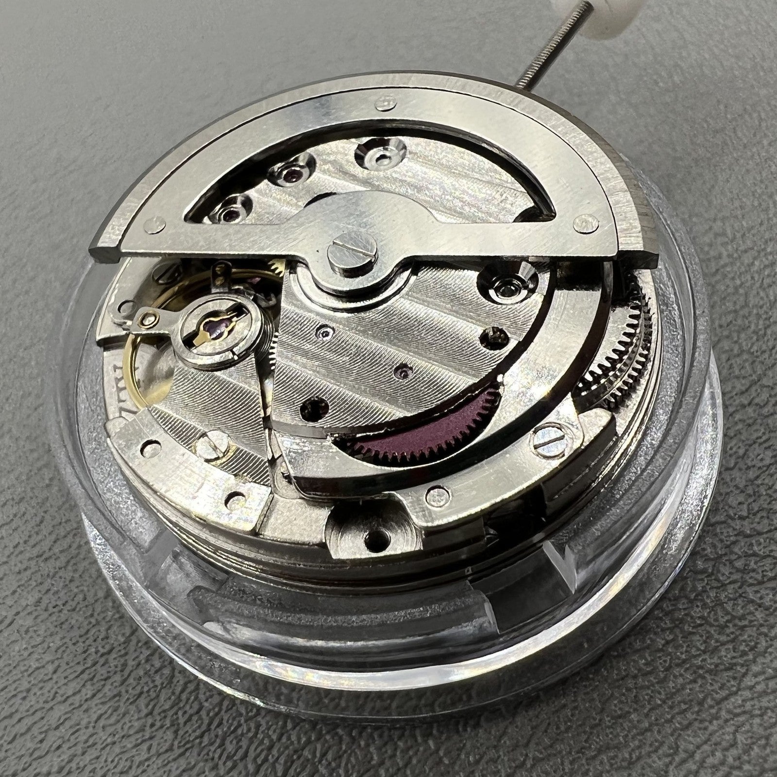 China Made 8205 automatic mechanical watch movement with small seconds at 3, 6, and 9 o'clock positions.