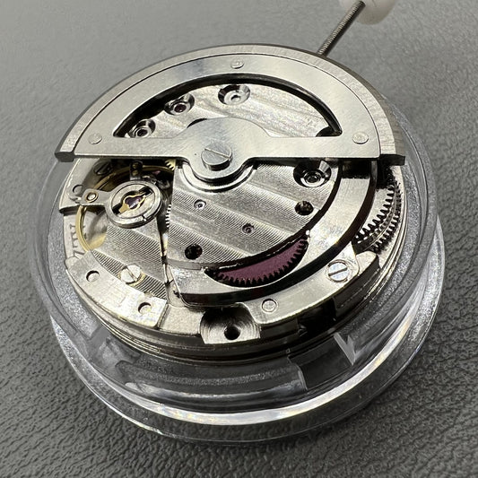 China Made 8205 automatic mechanical watch movement with small seconds at 3, 6, and 9 o'clock positions.