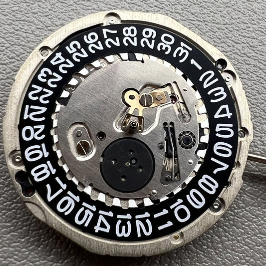 Seiko 5J32A quartz watch movement with black disk and single calendar display for accurate timekeeping