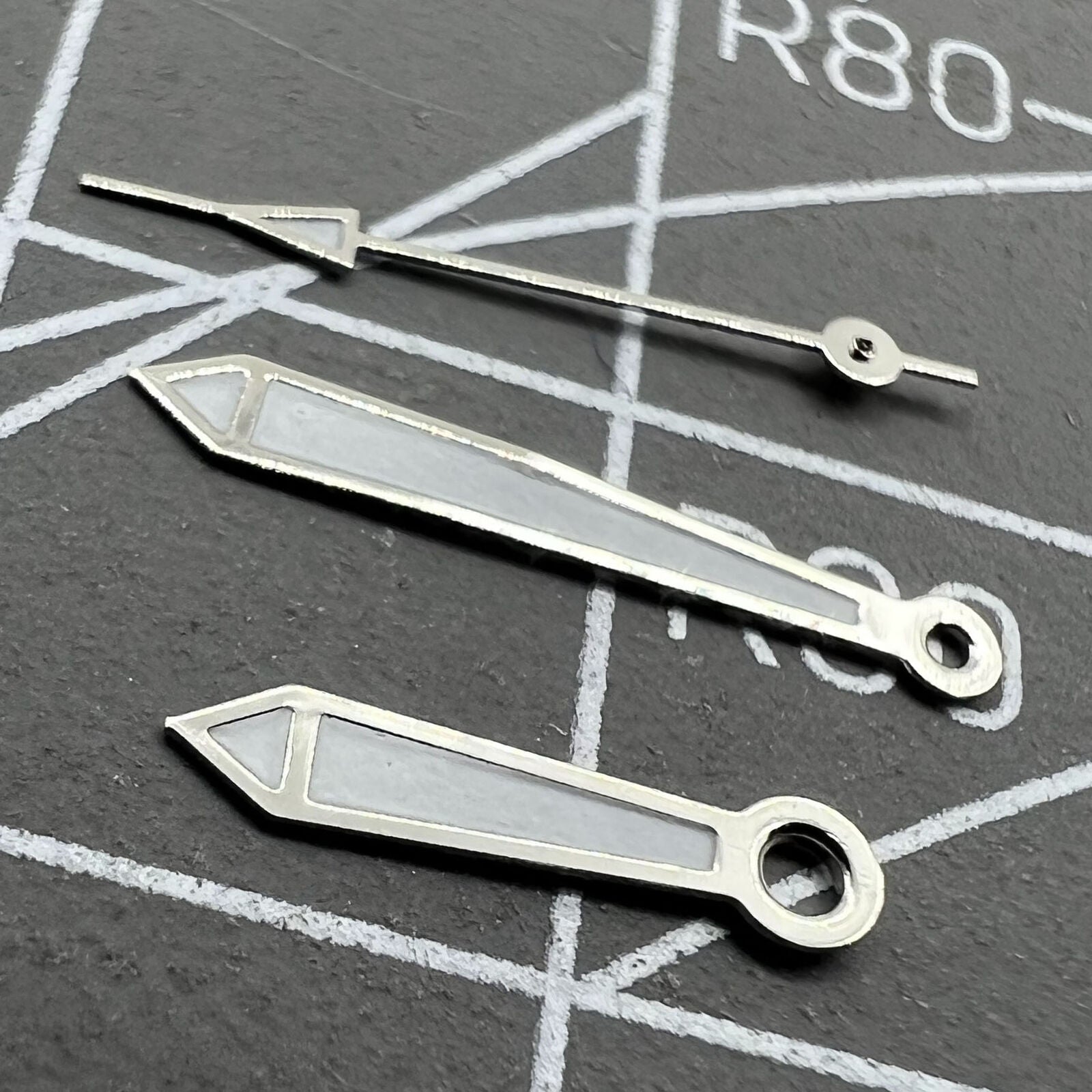 Green luminescent 13mm silver-trimmed watch hands compatible with Miyota 2315, 2035, 2036 models.