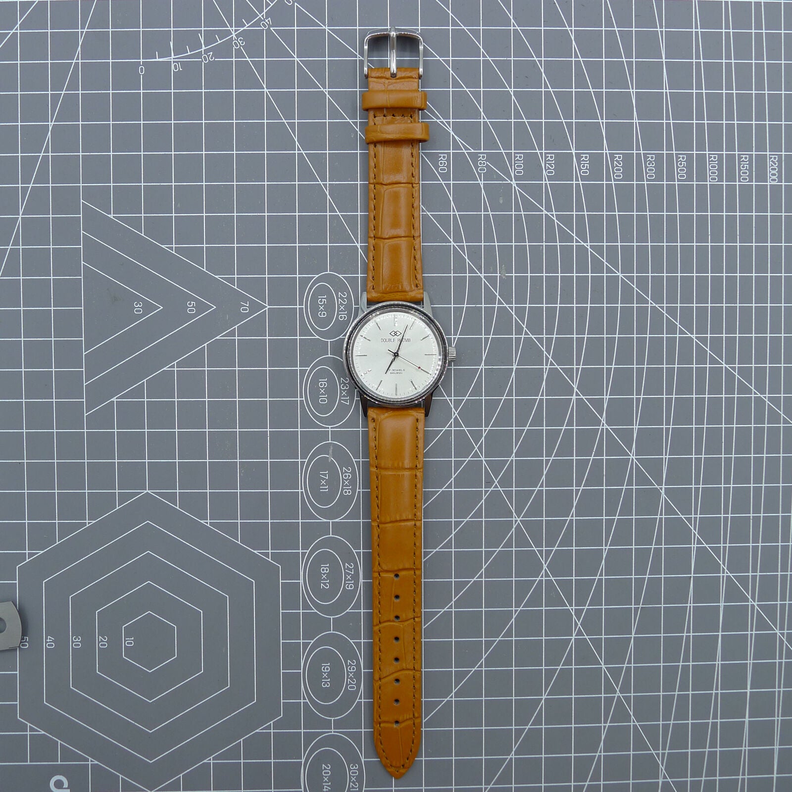 Beijing 36mm Double Rhomb watch with silver case and silver nail strap, manual mechanical movement for precise timekeeping
