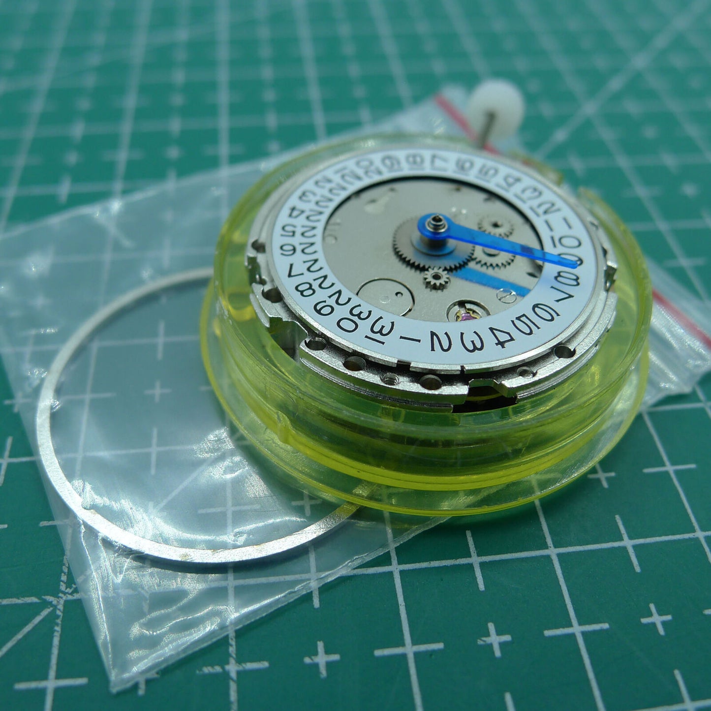 DG2813 mechanical watch movement featuring 4 hands and adjustable 24-hour GMT, silver finish for precise timekeeping and watch repairs.