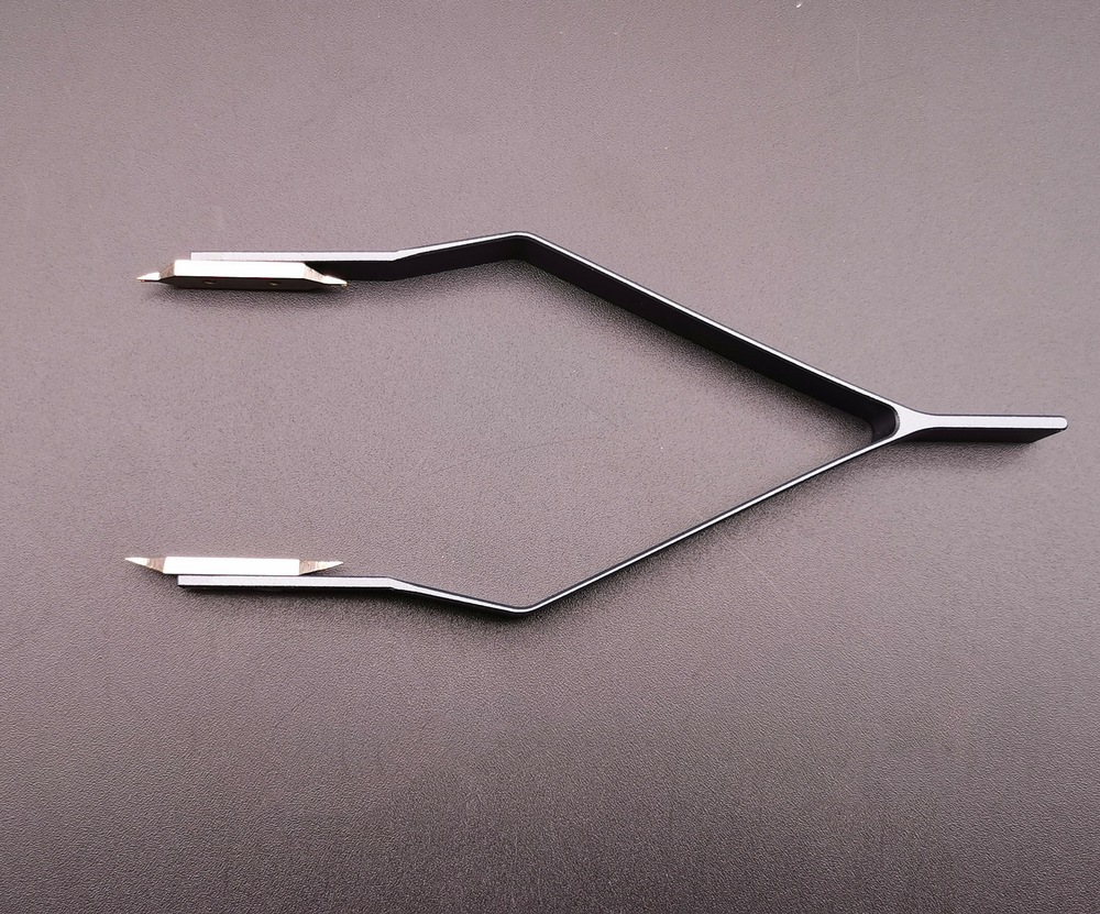 Precision stainless steel 7825 V type spring bar tweezers for secure watch band adjustments.