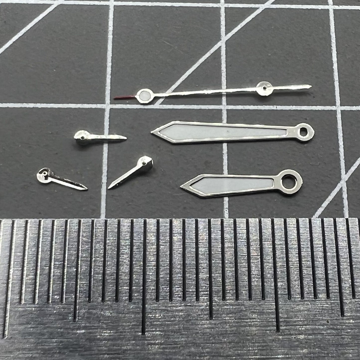 Arrow-shaped 13mm watch hands with silver trim and green lume for VD53 VD54 VD57 movements.