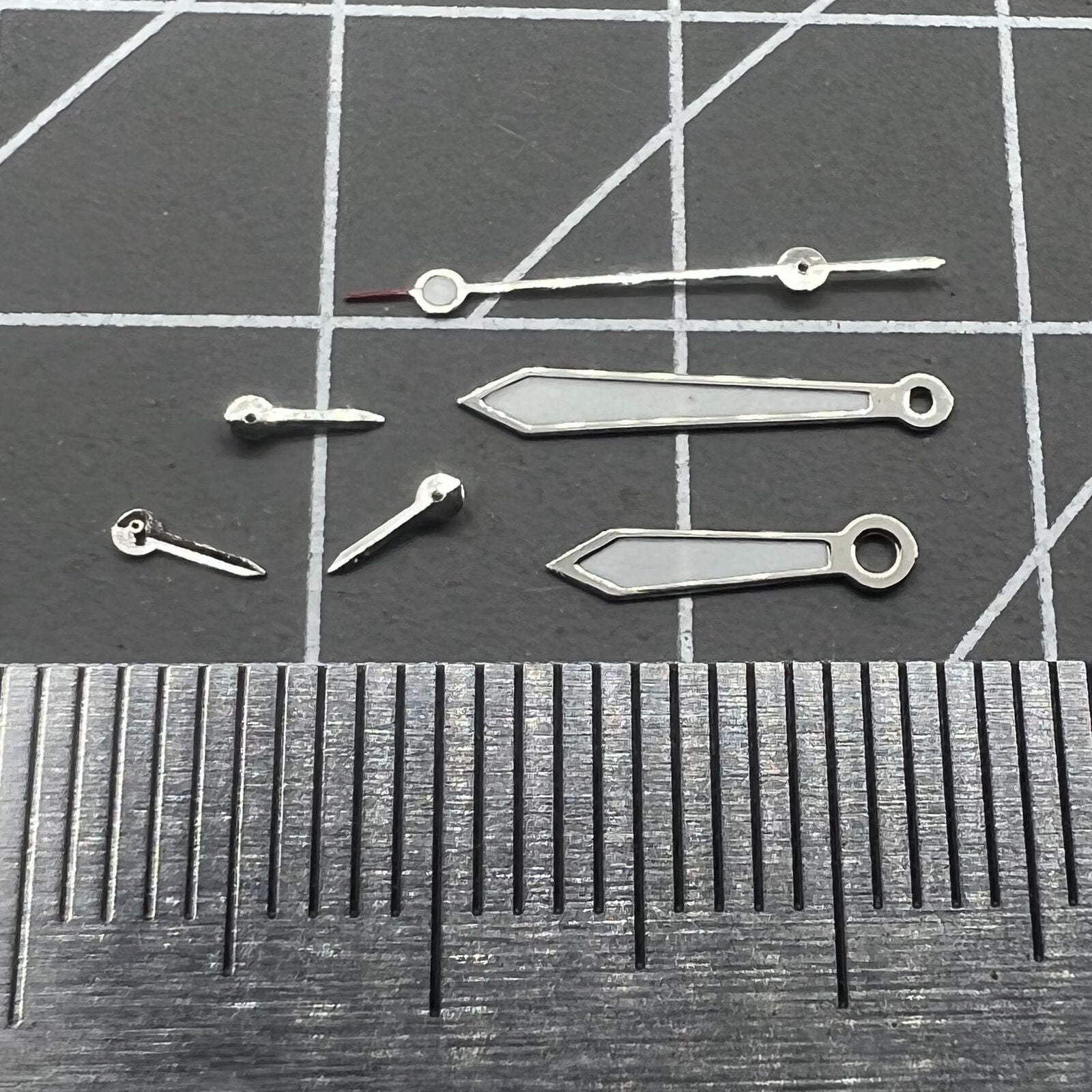 Arrow-shaped 13mm watch hands with silver trim and green lume for VD53 VD54 VD57 movements.