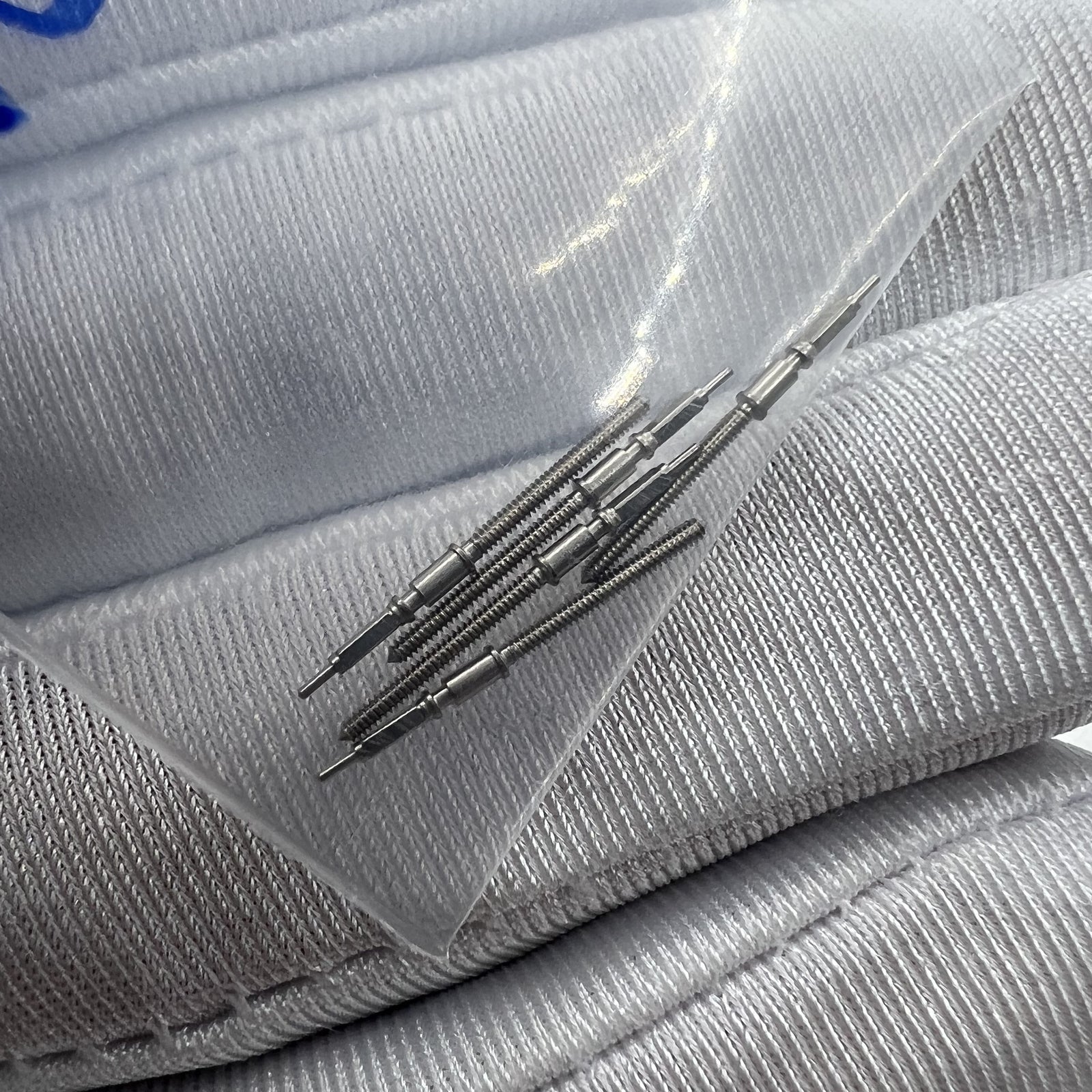 Chongqin watch stem for PT5000 movement, precise replacement part for watch repair.