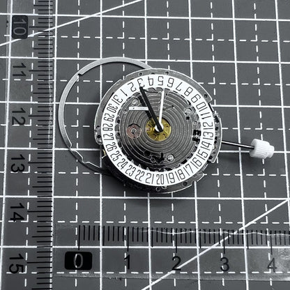 Swiss ISA 8171A quartz watch movement with white dial, four hands, and date at 6 o?clock for precise timekeeping.