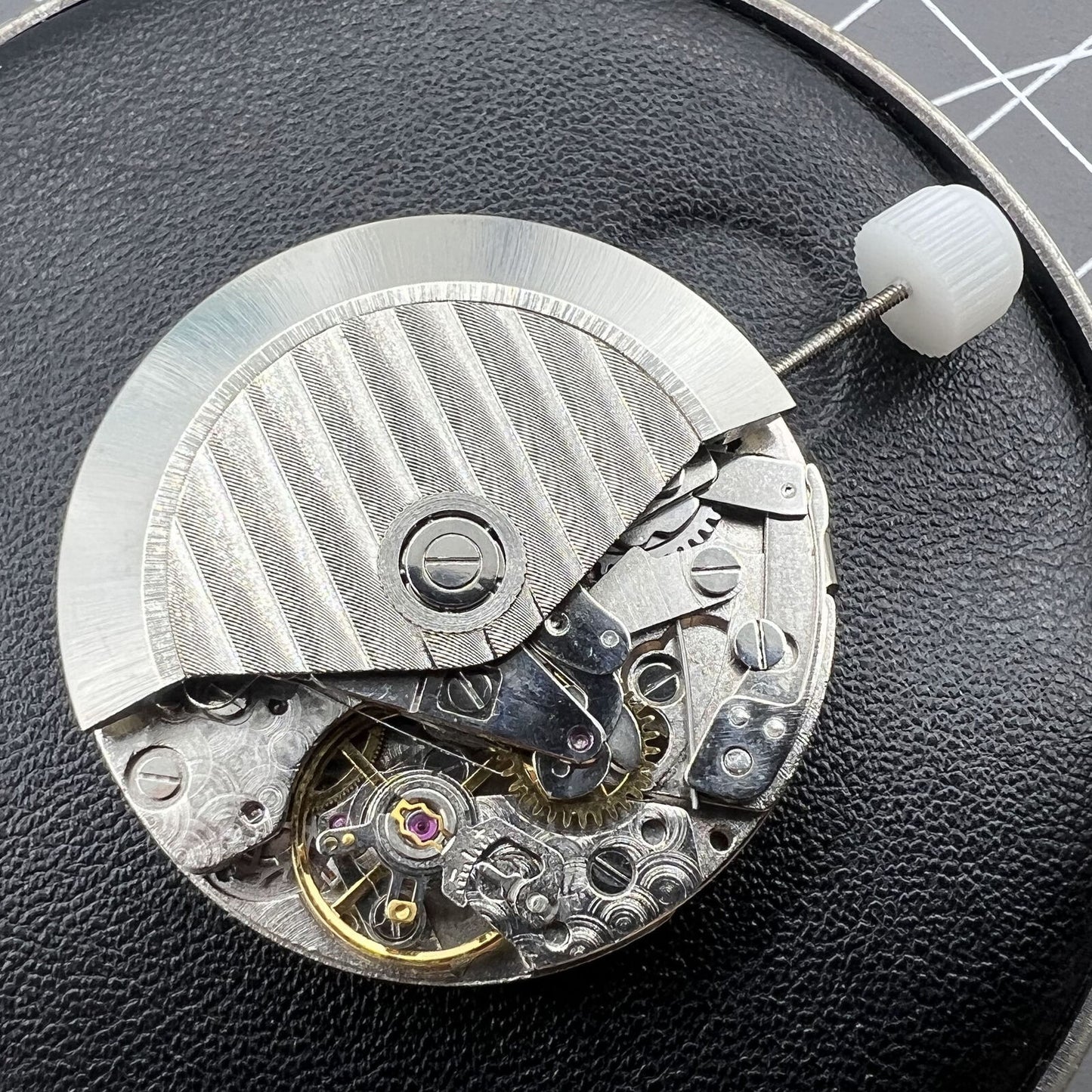 7750 Automatic watch showcasing mechanical movement with small second at 12, elegant style.