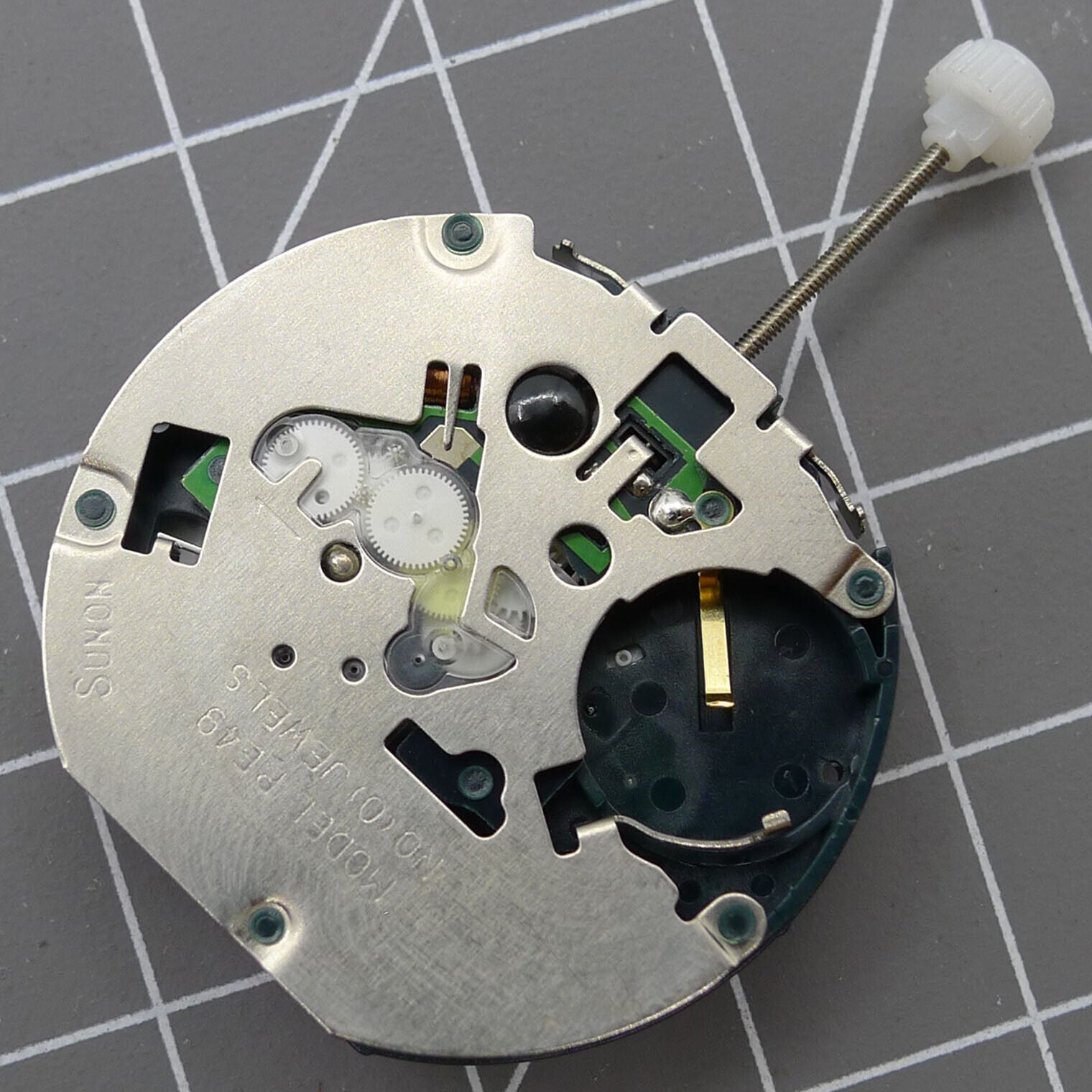 SUNON PE49 watch repair part featuring small second dial at 6 o'clock with quartz movement and date function.