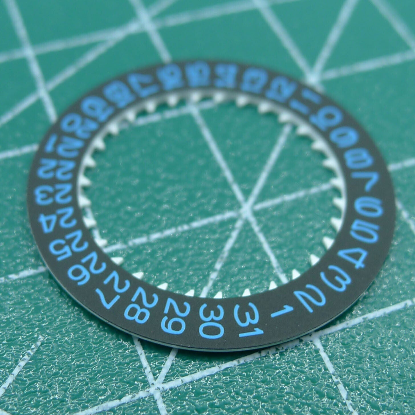 Blue font date disk wheel for NH35 watch movement on black background