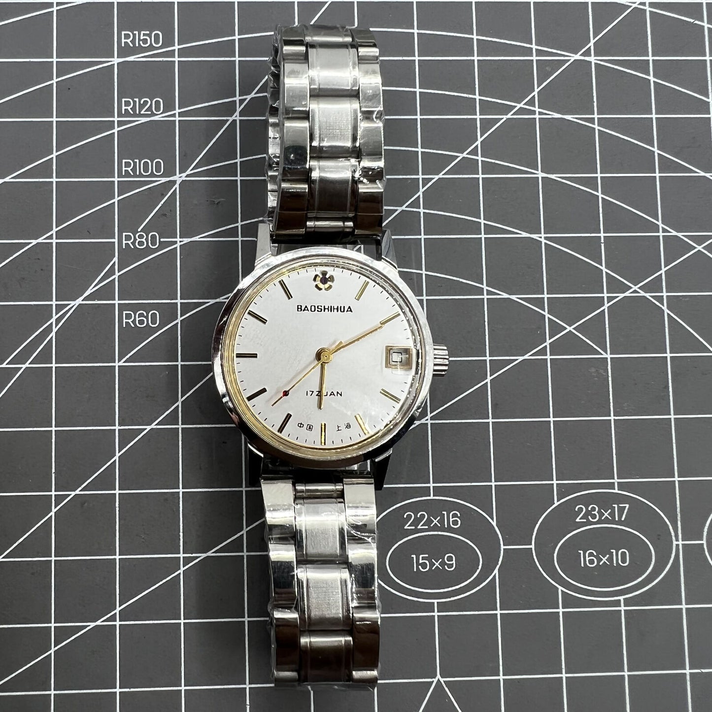 33mm Shanghai manual mechanical watch with single calendar, 17 jewels, shock-resistant design.