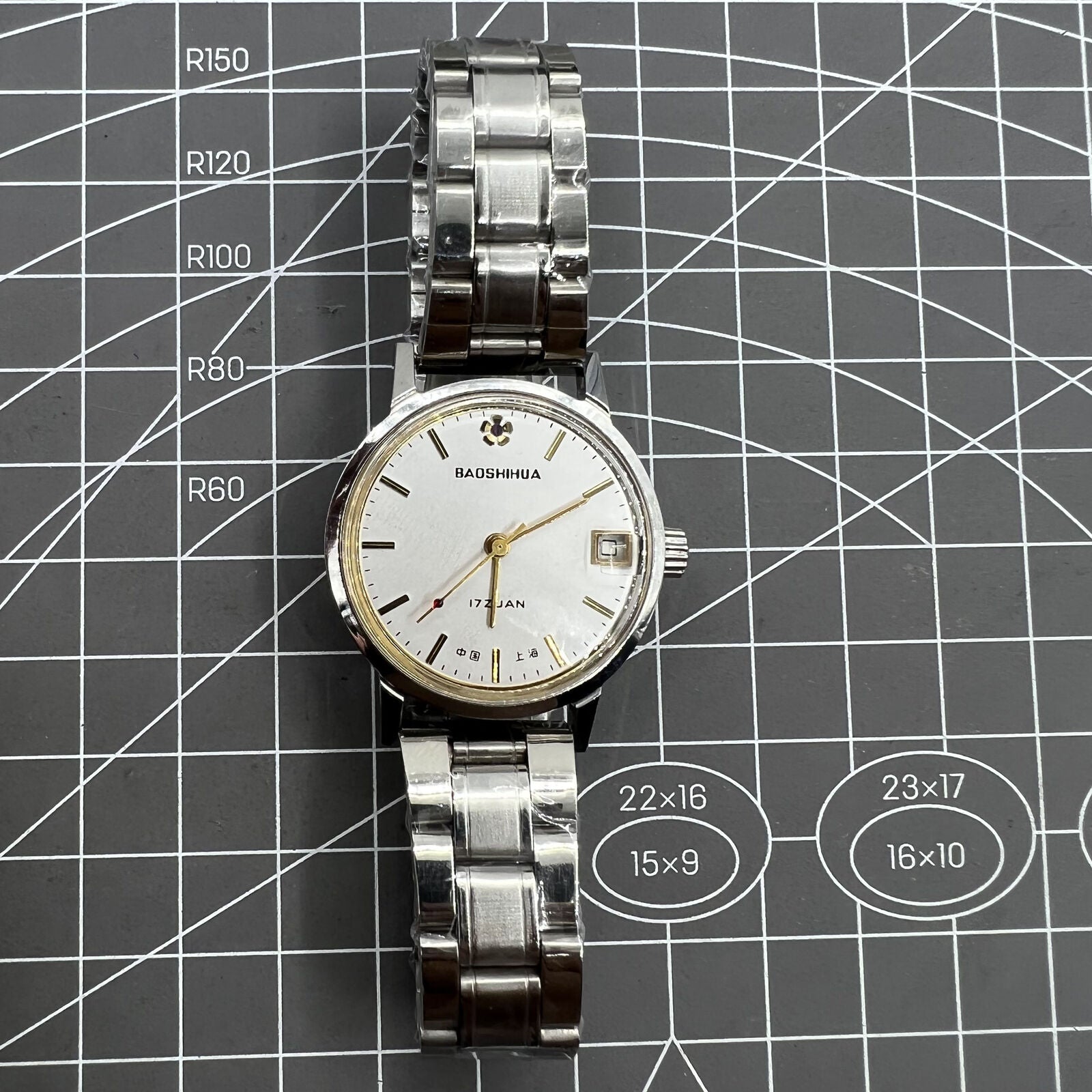 33mm Shanghai manual mechanical watch with single calendar, 17 jewels, shock-resistant design.
