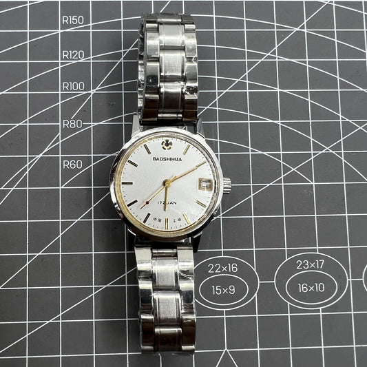 33mm Shanghai manual mechanical watch with single calendar, 17 jewels, shock-resistant design.