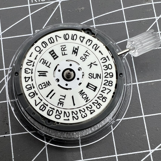 Miyota NH36A watch movement with white dial, blue luminescent markers, and 3/3.8 crown position for precise timekeeping.