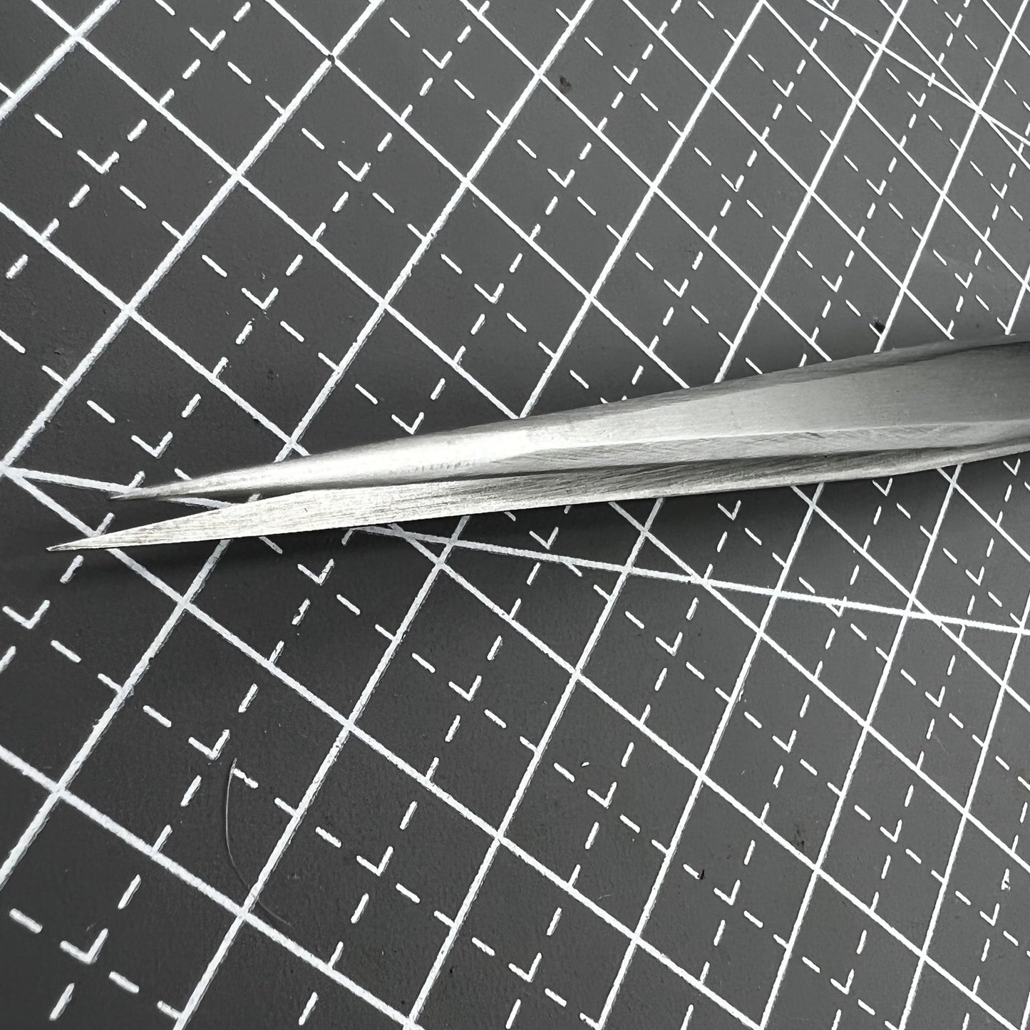 ST11 Superhard Antimagnetic Tweezer by Edelstahl, precision tool for watch repair and delicate accessory handling.