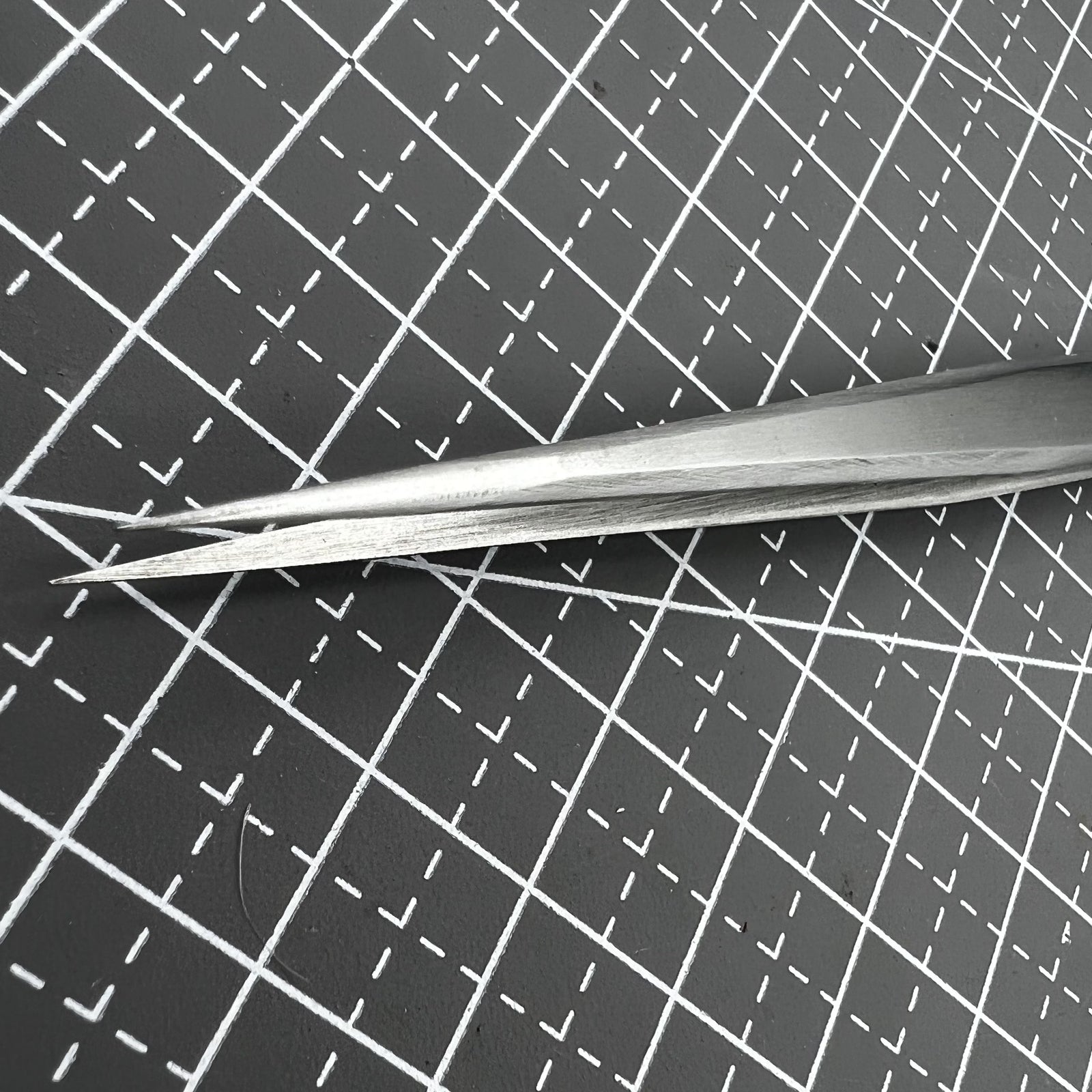 ST11 Superhard Antimagnetic Tweezer by Edelstahl, precision tool for watch repair and delicate accessory handling.