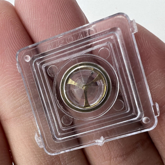 Golden complete balance wheel with hairspring for Orient 46941 46943 movement, precision watch accessory.