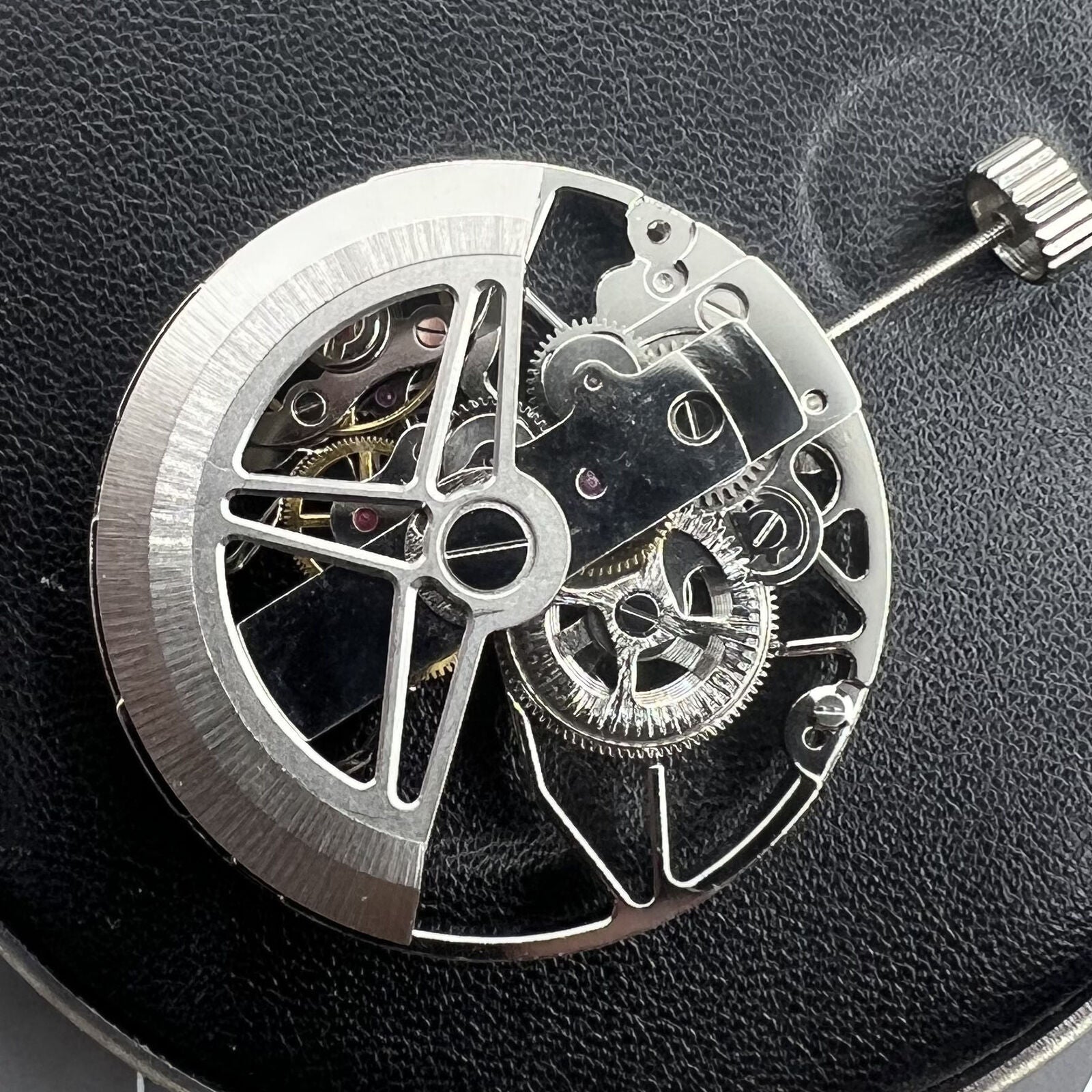 Dandong 8306 silver watch with hollow dial showcasing 2-hand automatic movement, elegant design for refined style.