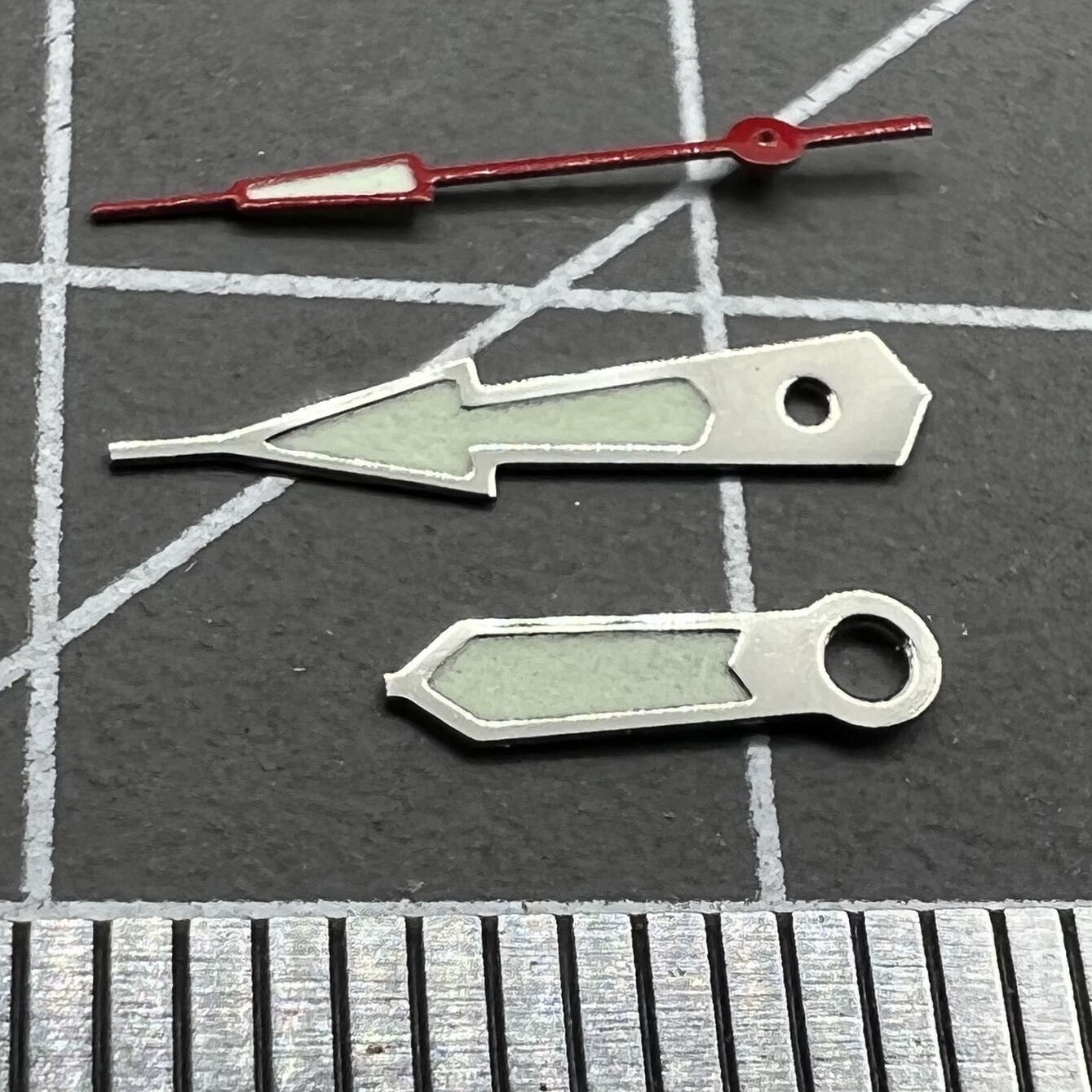 Silver trim green lume watch hands set for Miyota 2035 series, enhancing readability and style.