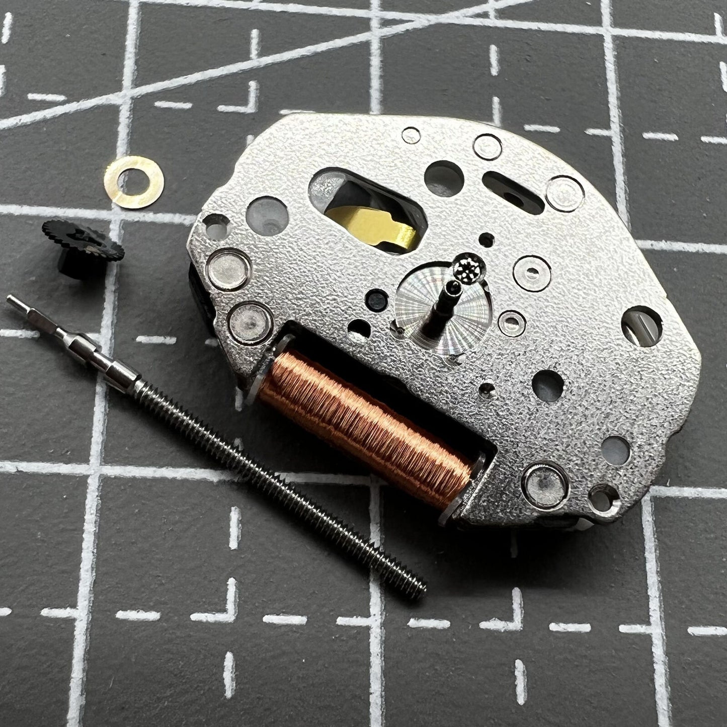 Miyota Citizen 2036 quartz movement with stem for precise watch repair and replacement.