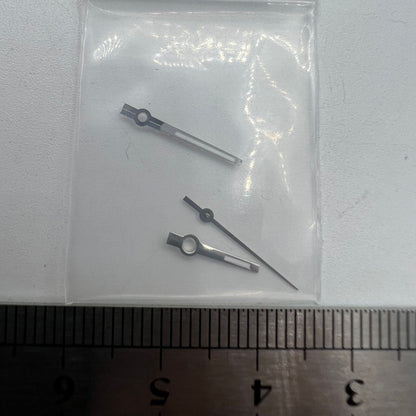 Silver-trimmed green luminous watch hands for NH35/NH36, enhancing visibility in low light, fit for Seiko movements.