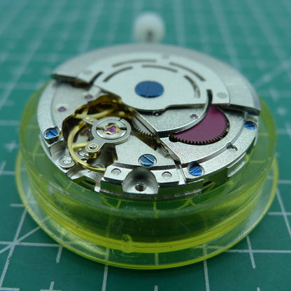 DG2813 silver-finish mechanical watch movement with 4 hands and adjustable 24-hour GMT for precision timekeeping.