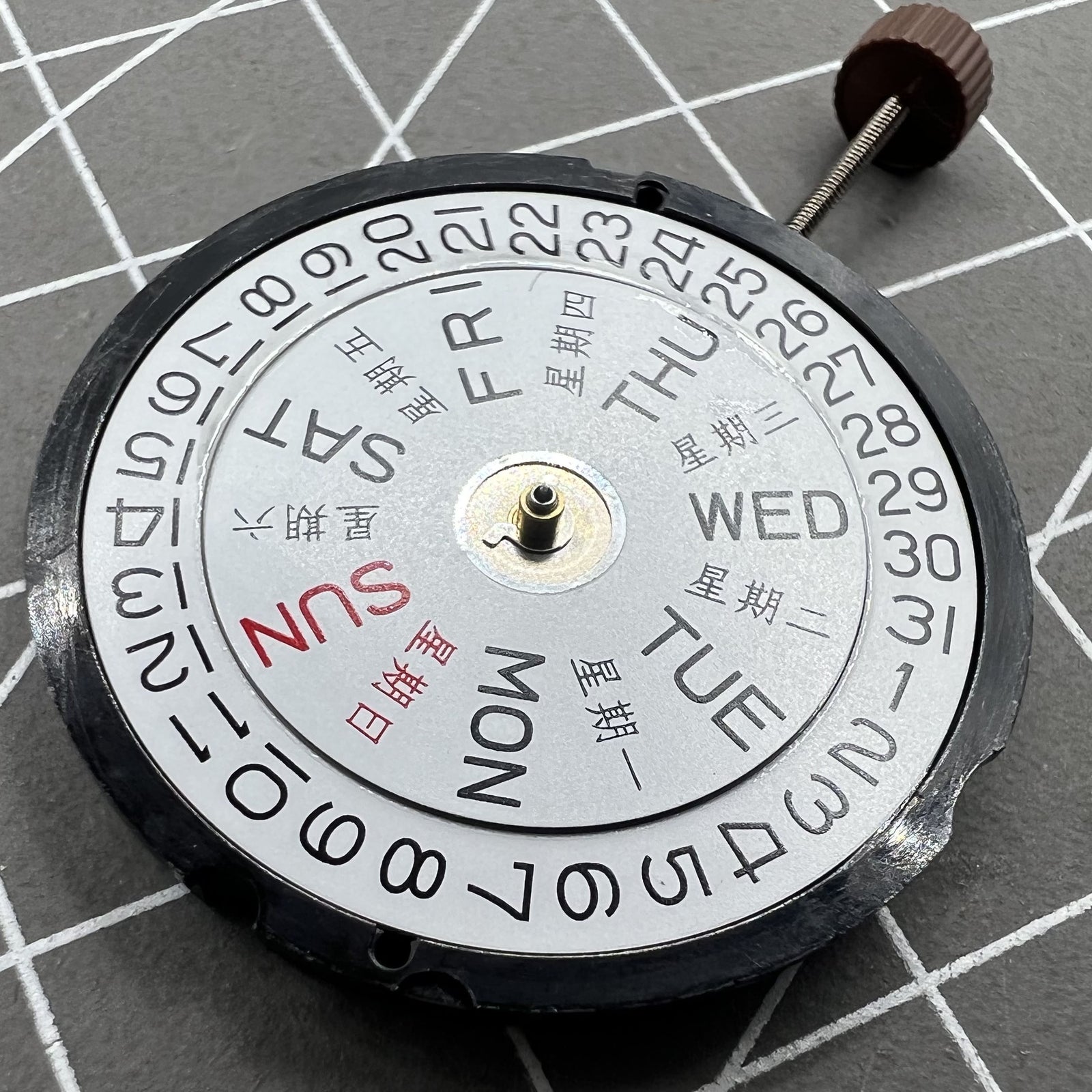 Ronda 517 quartz watch movement with day and date display at 3 o'clock position, suitable for watch accessories.
