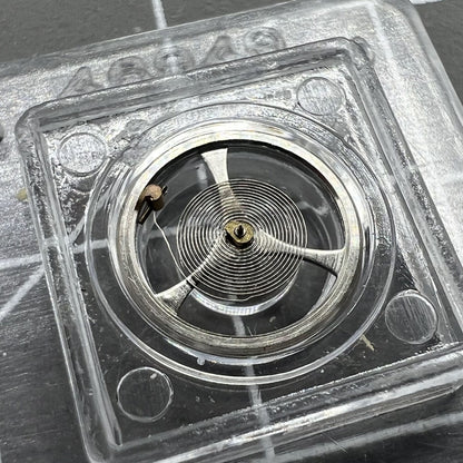 Balance wheel with hairspring for Movement 7009 Asian watch, precision fit for smooth timekeeping.